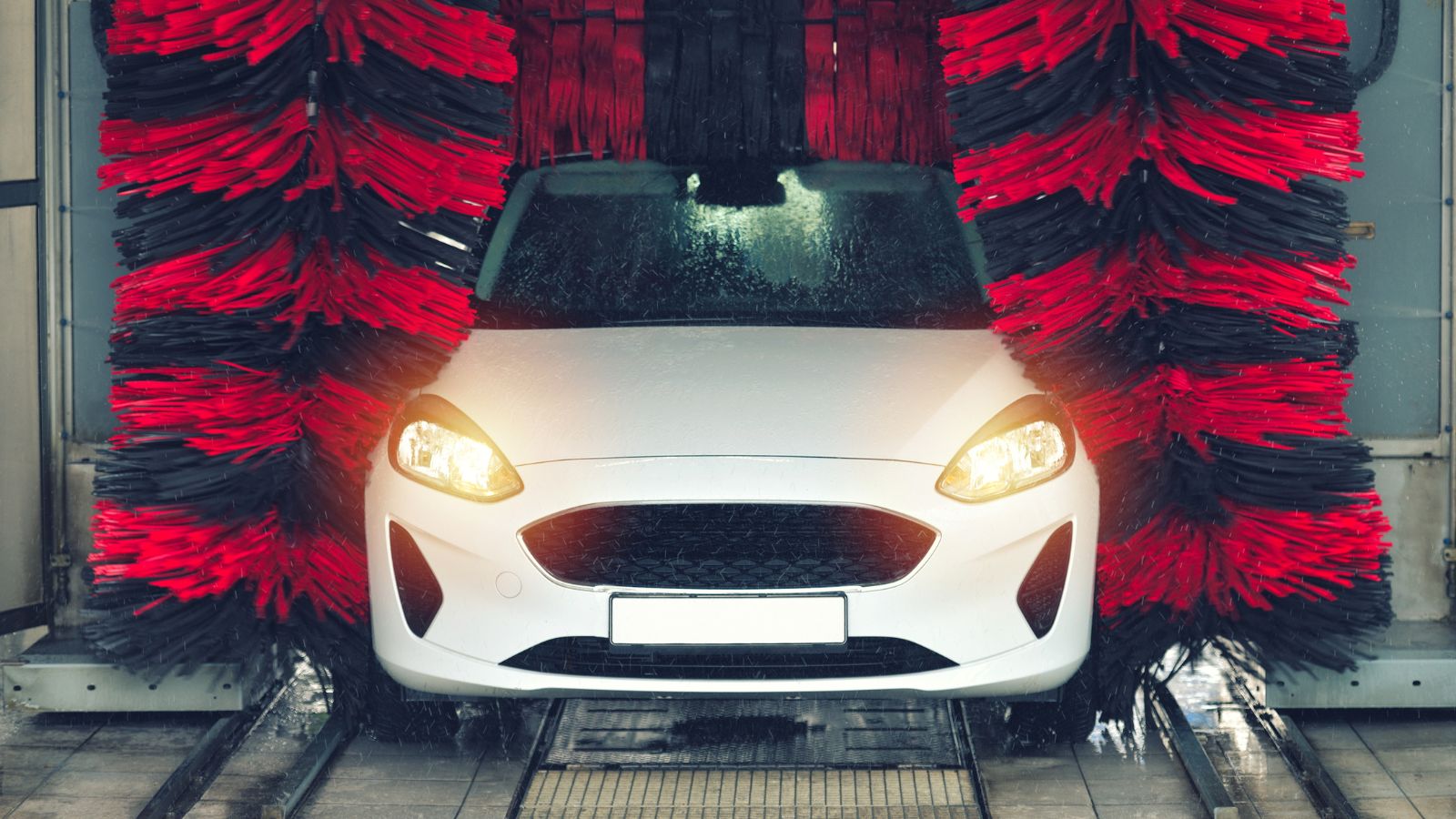 white car being washed in an iba car wash