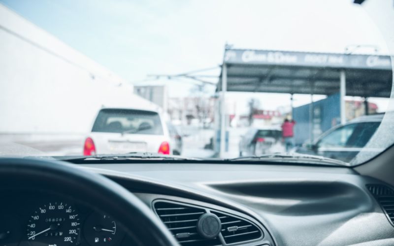 a line of cars as seen from the inside of a car that is in the line