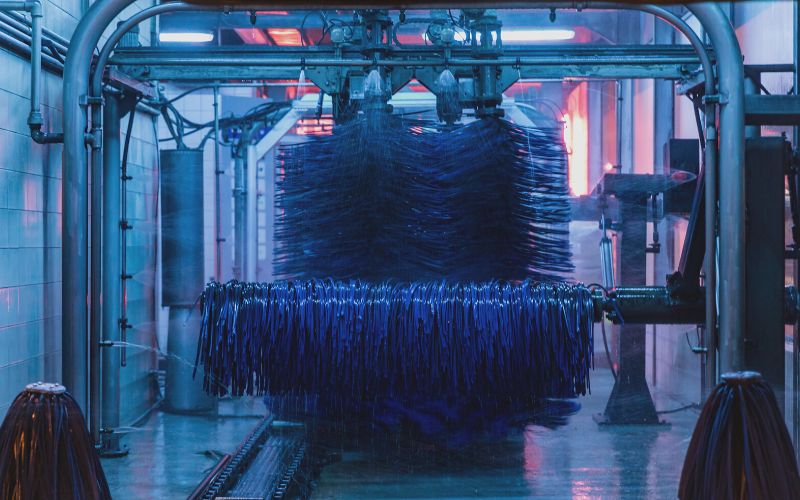 wraps inside a darkened car wash tunnel