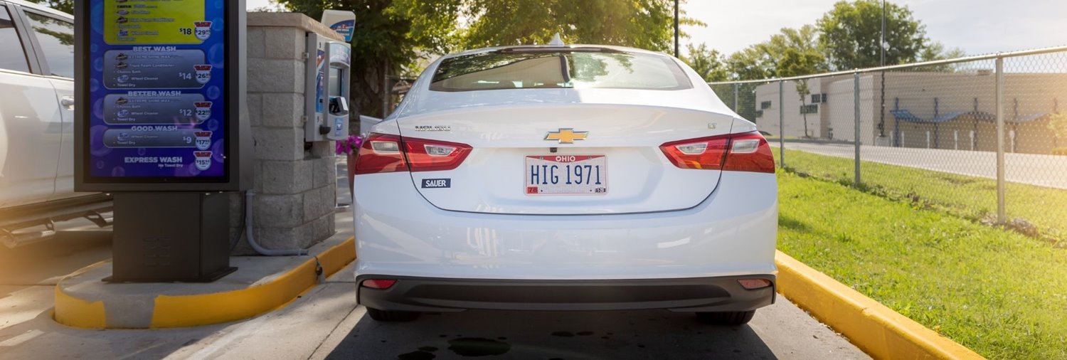 car being identified by license plate recognition at a car wash