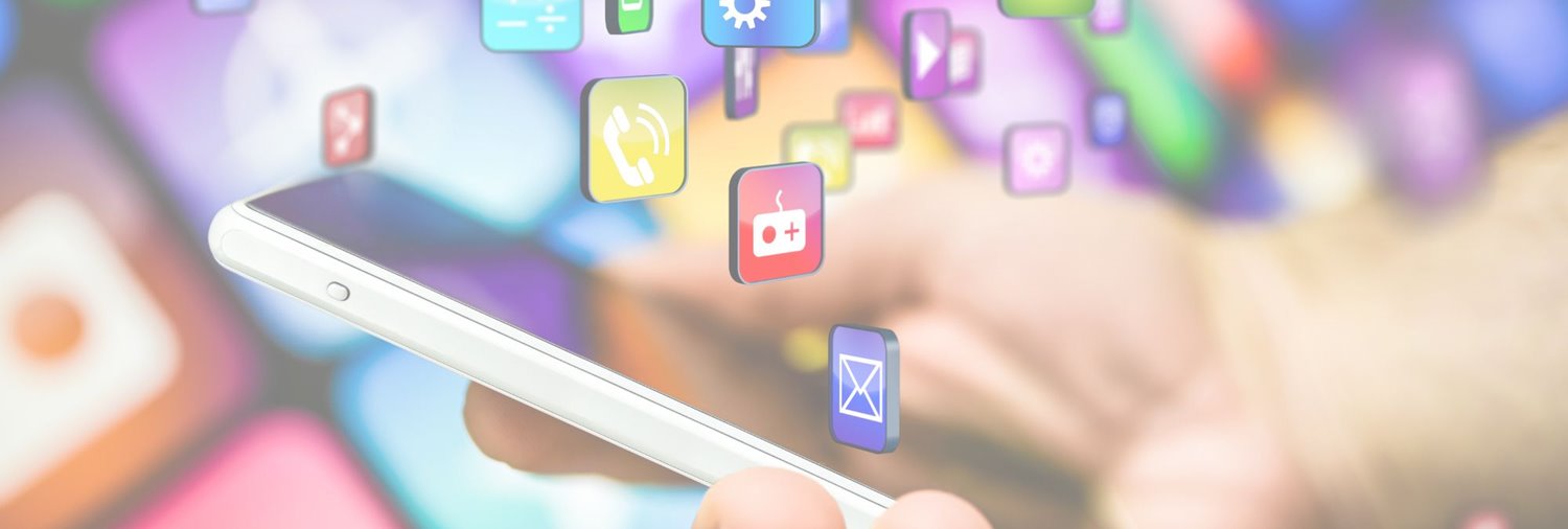 Person holding phone and apps displayed