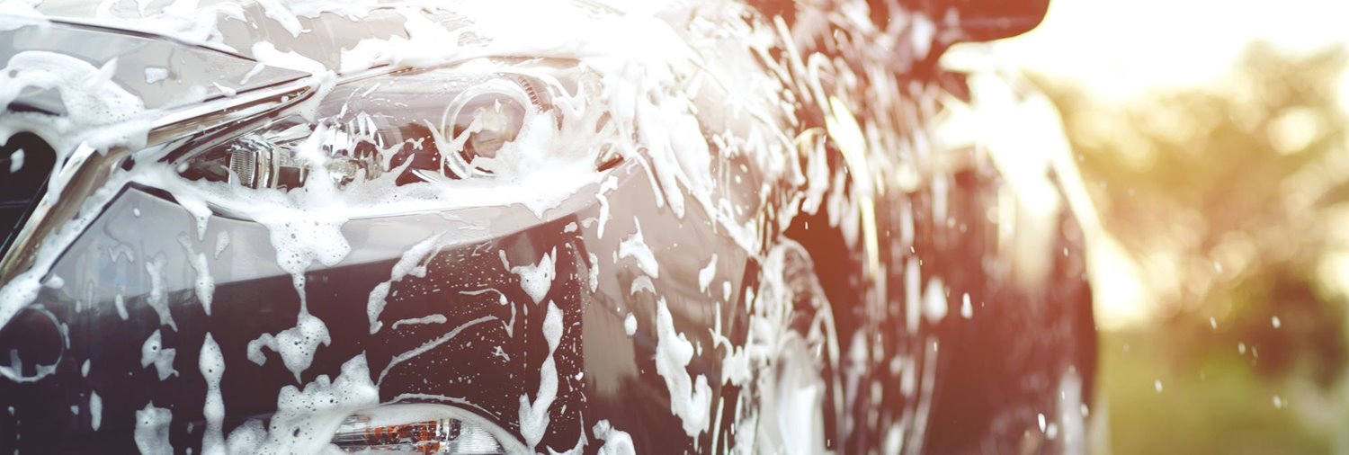 Black car with soap suds on it
