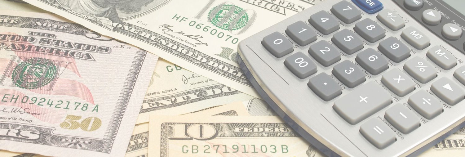 Calculator and dollar bills