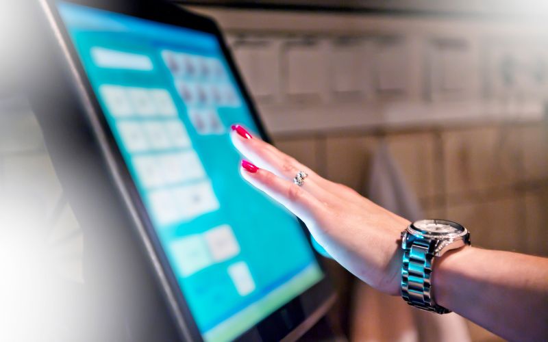Woman's hand touching a screen
