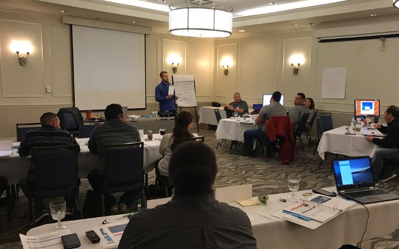 car wash operator speaking to other operators at a drb university event