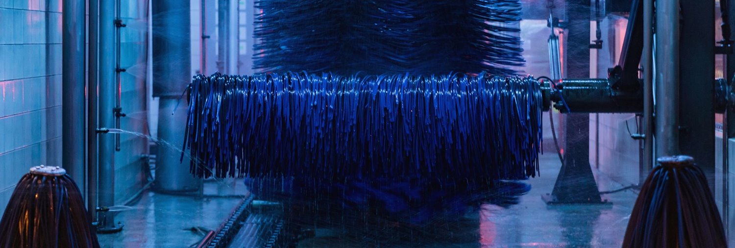 wraps inside a dark car wash tunnel