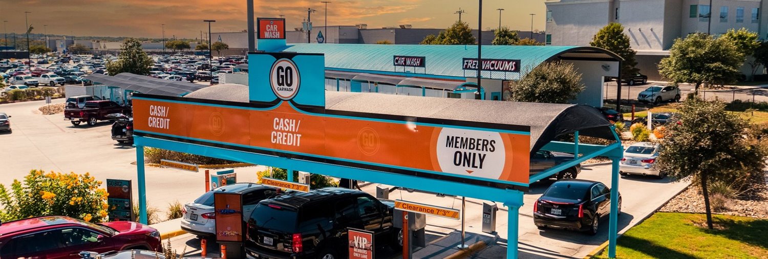 Cars lined up in the lanes at a GO Car Wash location