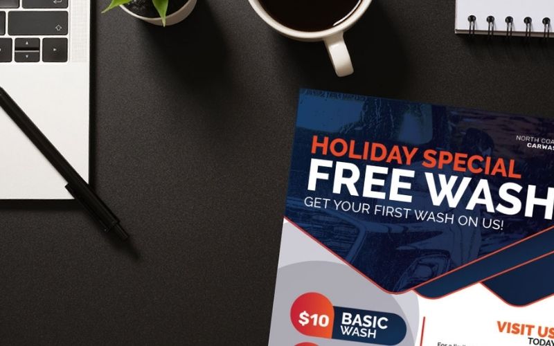 desk with a car wash promotion flier on top