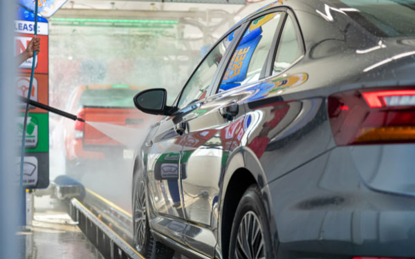 car going through car wash tunnel showing how CarPics reduces downtime