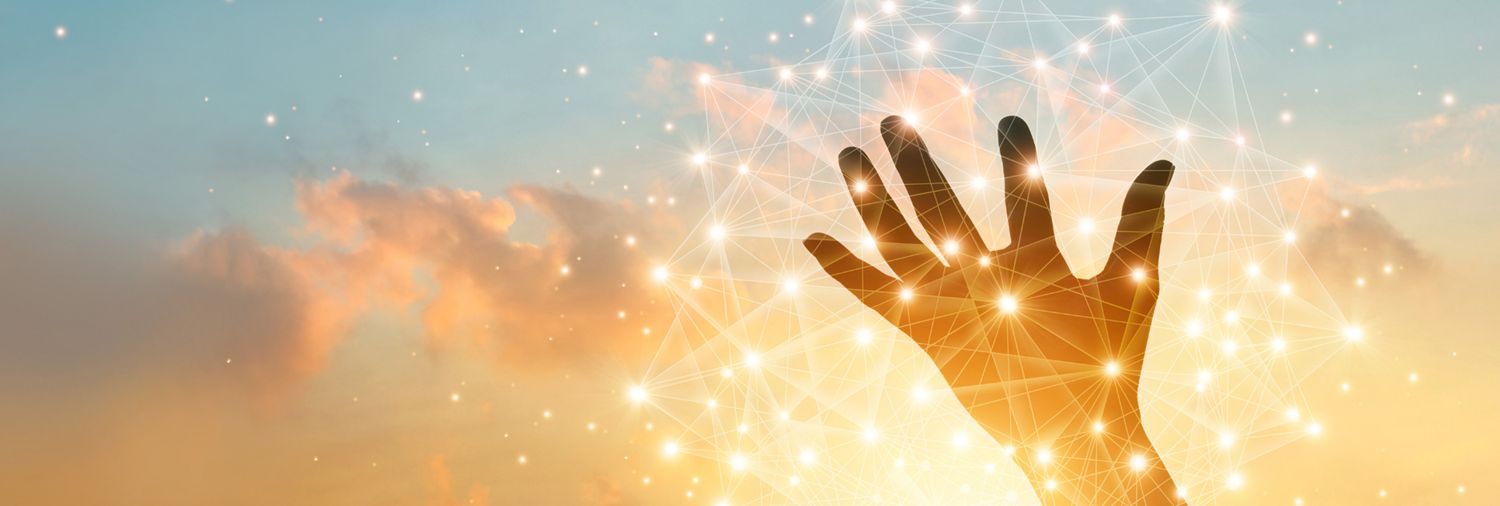 silhouette of a hand palm up backdropped by a cloud-filled, sunset sky overlayed by data points
