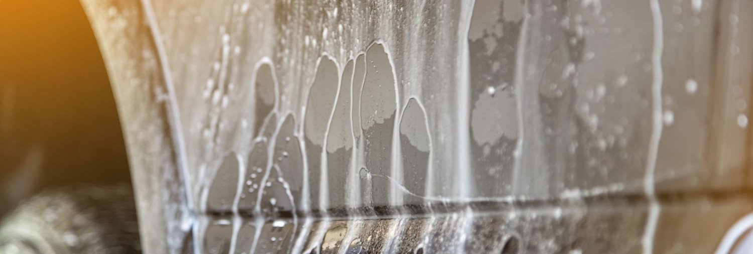 soapy water running off a vehicle near the tire