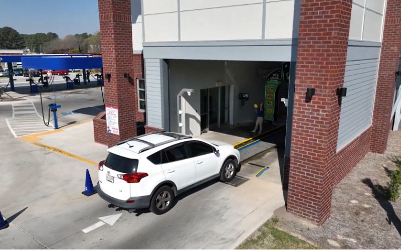 car entering the car wash building