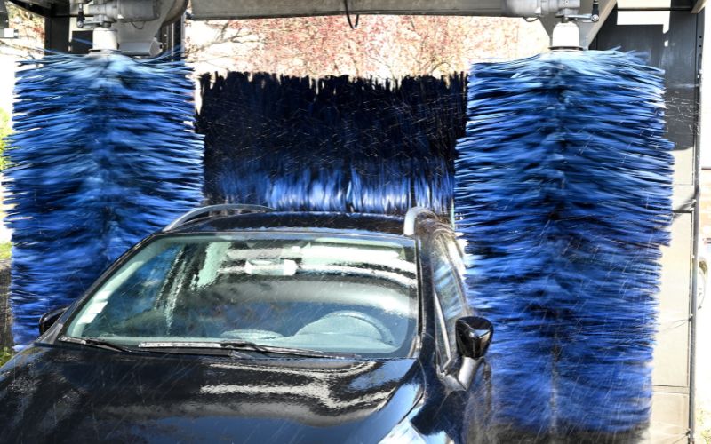 Car getting washed in an in-bay